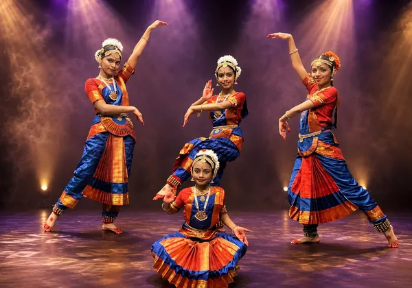 Senior Bharatanatyam dancers performing in a group formation on stage at Spotlight Academy, The Woodlands TX