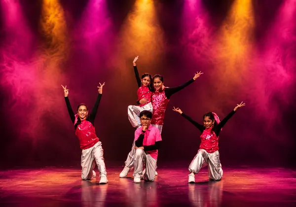 Teen Bollywood Dance students in a group formation on stage at Spotlight Academy, The Woodlands TX
