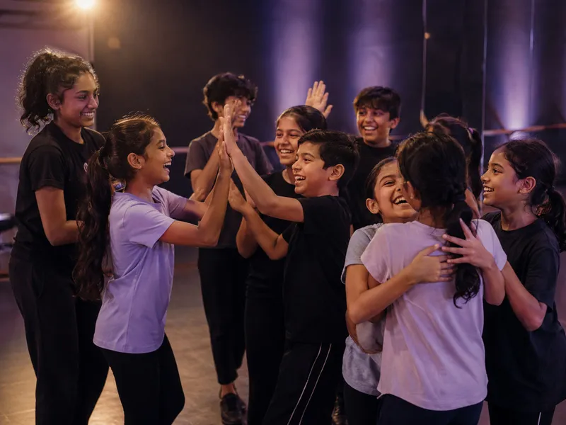Kids laughing and dancing together in a studio at Spotlight Academy, Spring and The Woodlands TX