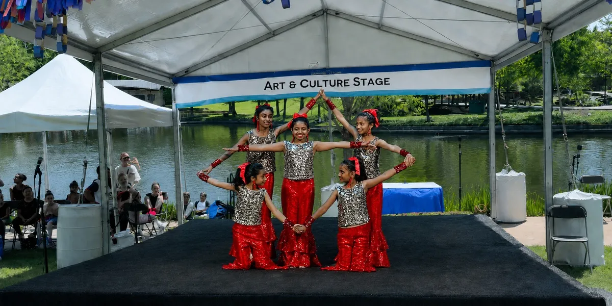 Spotlight Academy students performing at The Woodlands Waterway Arts Festival, serving families in Spring TX