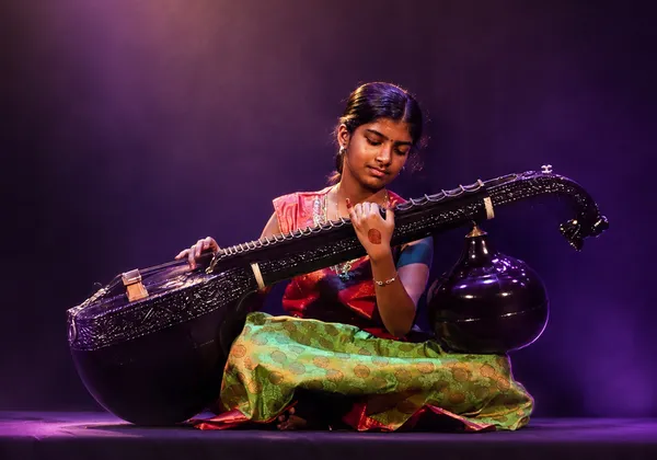 Veena students performing at Spotlight Academy community event